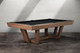 Gracy slate pool table by Doc & Holliday shown in walnut finish, transitional modern design with angular pedestal base Gracy slate pool table by Doc & Holliday shown in walnut finish, transitional modern design with angular pedestal base